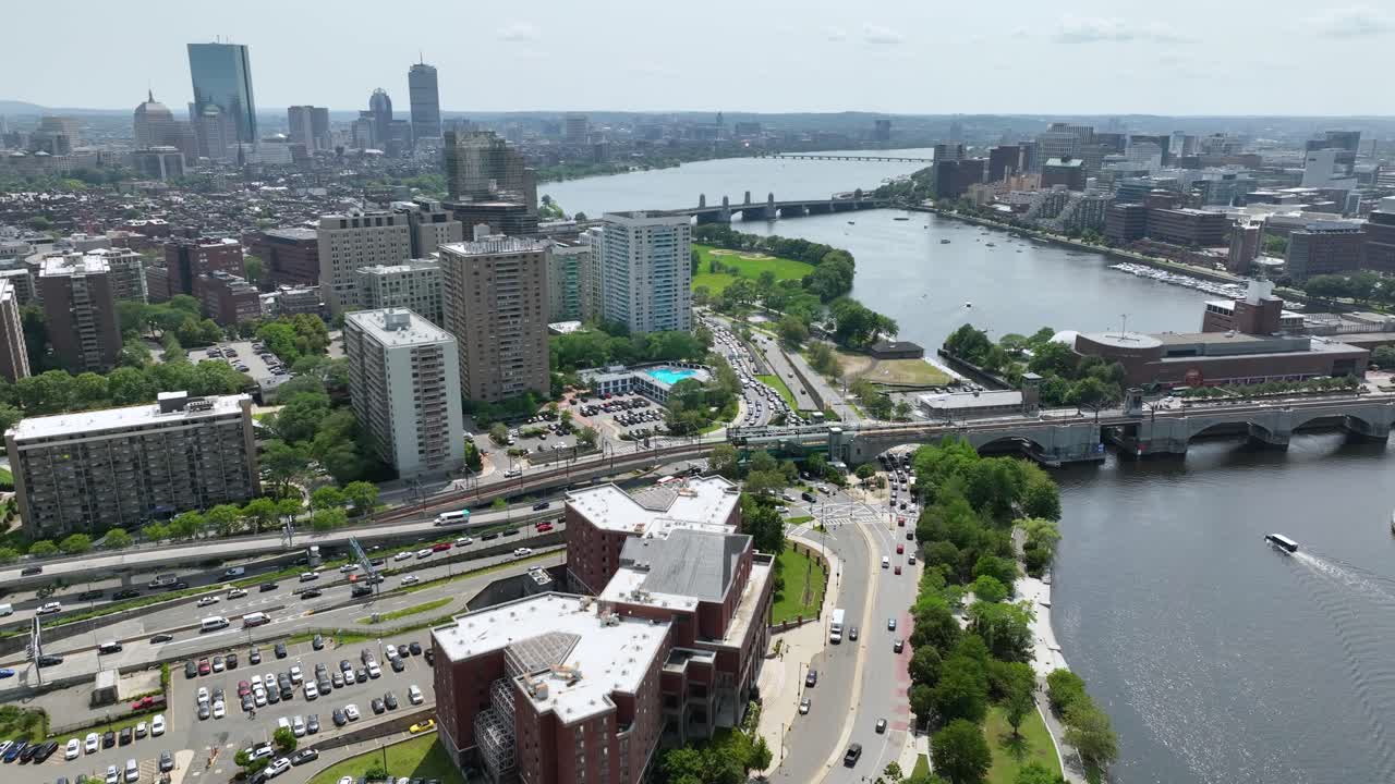 Drone shot of the Charles River cutting through Boston's urban areas