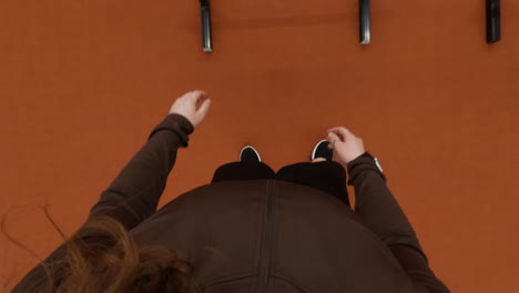 first-person perspective of feet and gym equipment during a workout