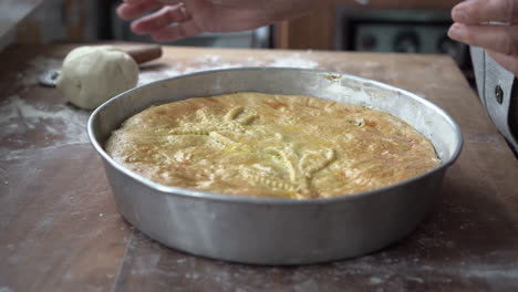 preparation of stuffed pizza with escarole, olives and passed to the oven, neapolitan food in christmas and easter time