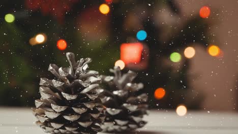 Animation-of-snow-falling-over-christmas-cones
