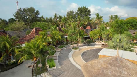 rental houses or bungalows at frii resort in gili trawangan island - aerial rising over accommodation facilities on sunny day