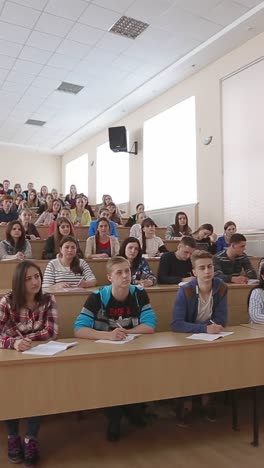 teacher with students at the college lecture hall