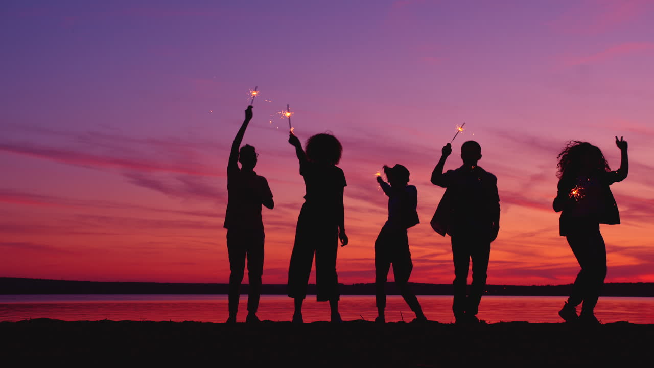 Friends Celebrating Sunset with Sparklers