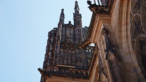 the-majestic-side-wall-of-Metropolitan-Cathedral-of-Saints-Vitus,-Wenceslaus-and-Adalbert-a-Roman-Catholic-metropolitan-cathedral-in-Prague,-Czech-Republic