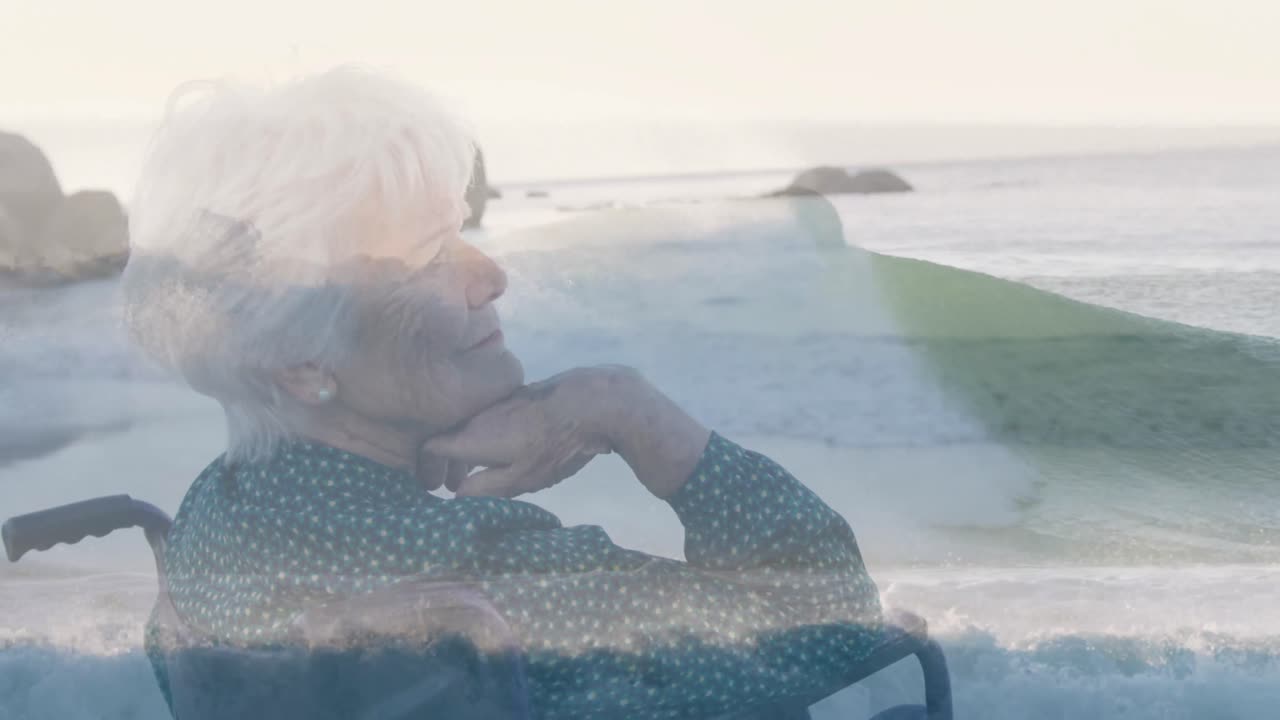 Animation of sea landscape over disabled cuacasian woman sitting in wheelchair