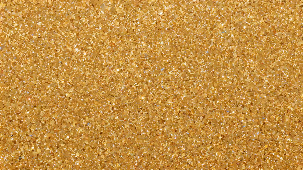 Shimmering dense gold glitter field catching studio light, creating flickering specular highlights