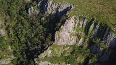 Pan-down-view-of-rocky-flat-mountain-wall-