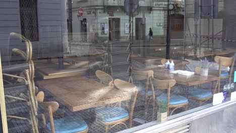 an empty restaurant in the historical centrum of a city.
