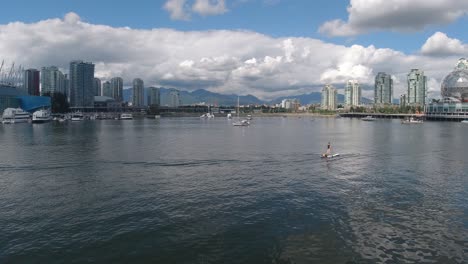 aerial hold over false creek olympic village where paddle board dock at rental dock yachts - dinner cruise boats park by posh residential luxury condominiums close to science world vancouver city03-10