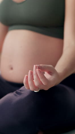 pregnant woman practicing yoga and meditation