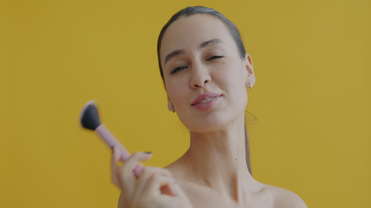 Woman applying makeup with brush