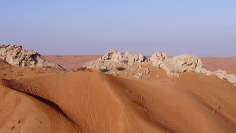 4k drone footage, aerial view of fossil rocks plateau in mleiha desert with sand ripples, geological landscape of the sphinx in sand dunes desert in the united arab emirates, drone videos