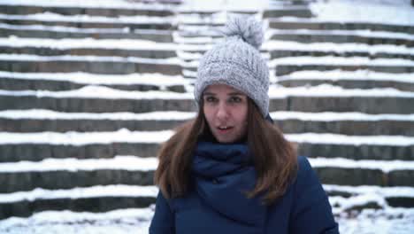 woman playing with snow