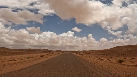 Vastness-of-unexplored-remote-Tunisia-desert-landscape-on-cloudy-day,-car-driver-point-of-view
