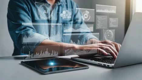 developer working with artificial intelligence data analytics on a laptop and tablet