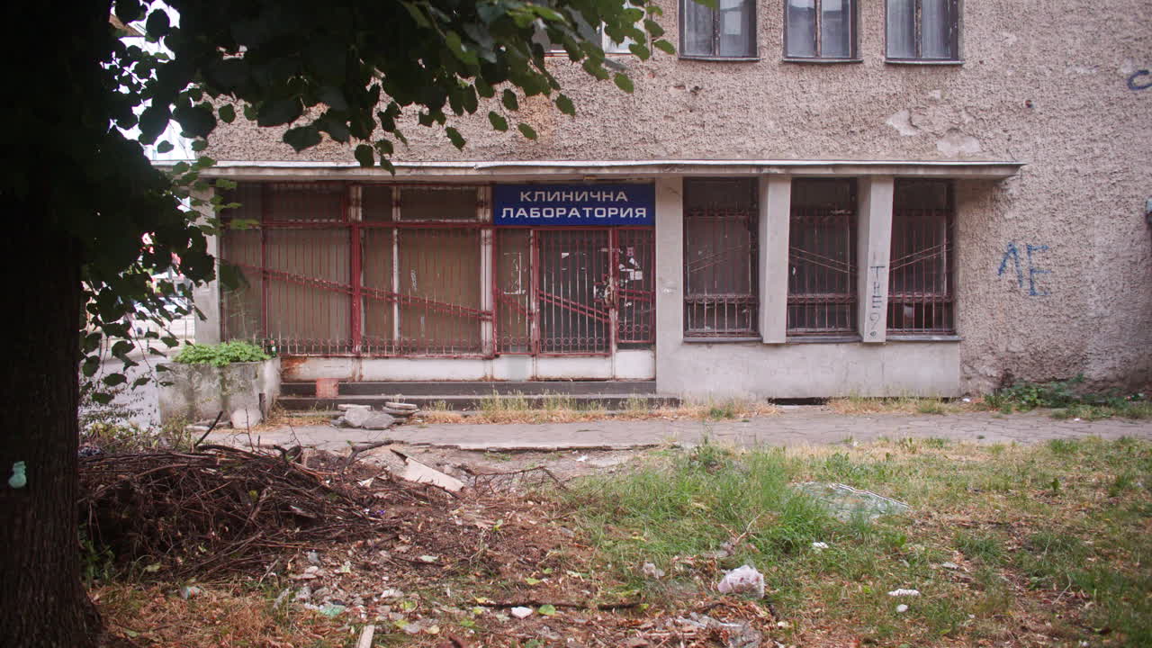 A neighborhood with communist architecture apartment buildings and the surrounding neighborhood environment, parks and trees from the communist era on the Balkans in Sofia, Bulgaria, Eastern Europe