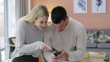 a young couple looking at something surprising