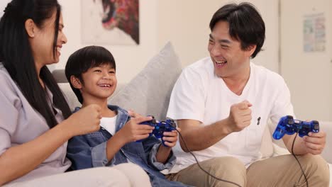a joyful family plays video games together, sharing laughter and excitement in a cozy living room setting