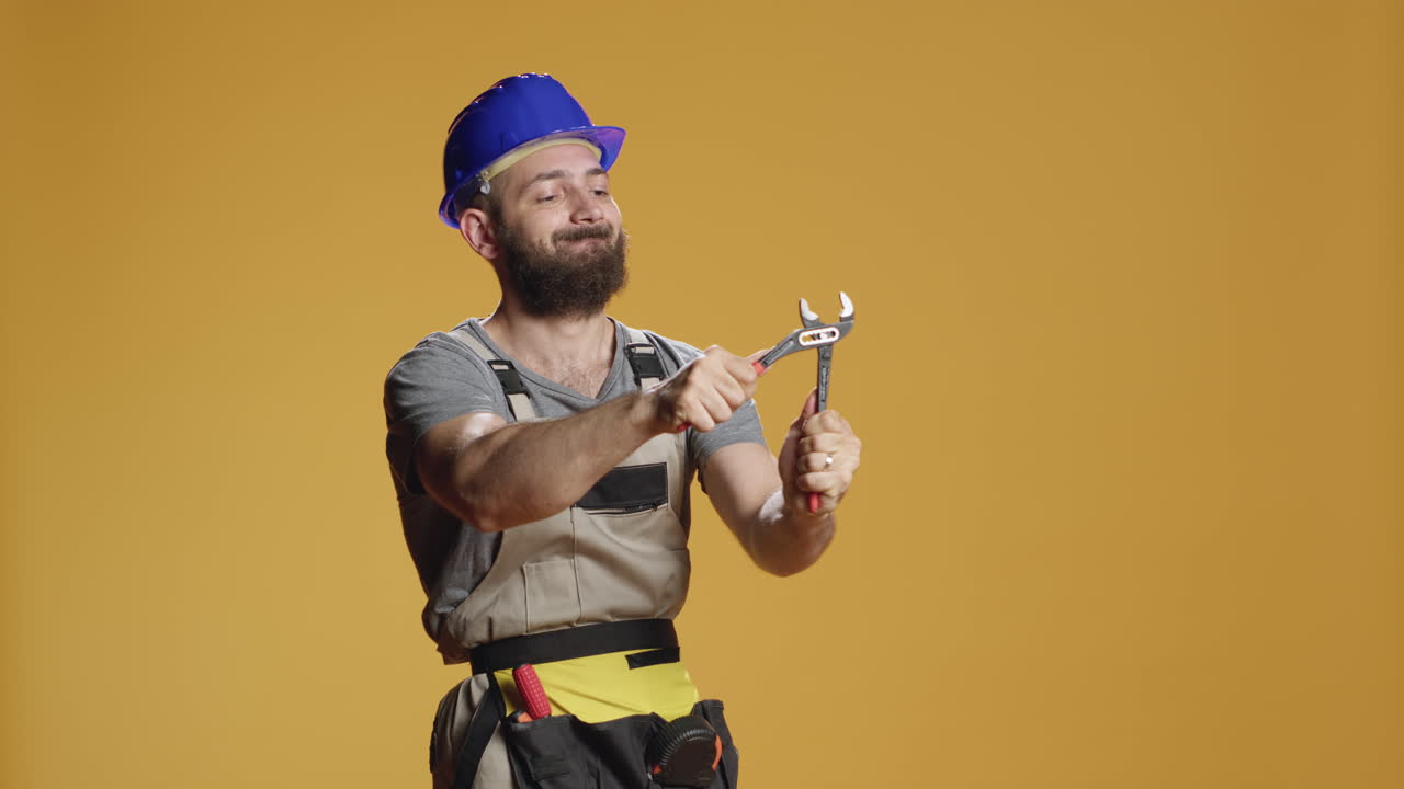 Construction craftsman working with steel wrench on renovation