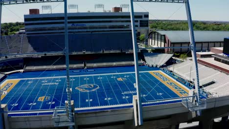 aerial view of the boise state football field, empty at midday.