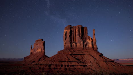starry night over monument valley rock formations