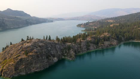 4k drone fly over of rattlesnake point at kalamalka lake in british columbia, canada