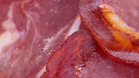 Sliced-and-seasoned-air-dried-pork-loin,-extreme-close-up-view-in-4k