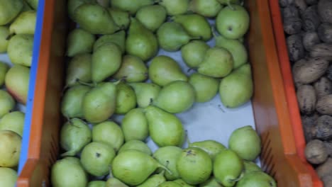 bins of fresh fruits and nuts at the market