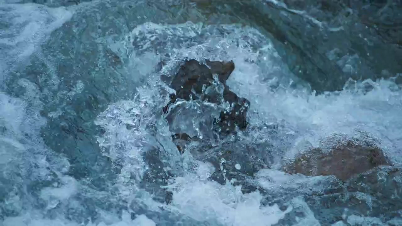 Rock being washed by a river stream