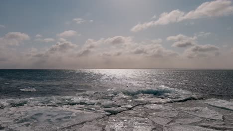 scenic view of the ocean and icy frozen waters near duluth minnesota - wide shot