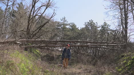 A-Young-Woman-With-Short-Hair-Takes-A-Walk-With-Her-Dog-In-The-Woods-1