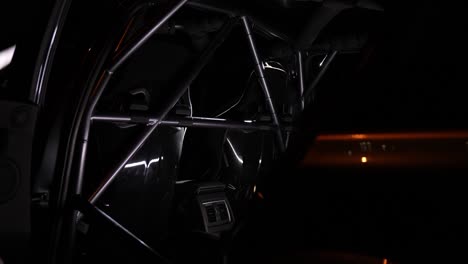 safety cage detail shot in a professional racing car at night