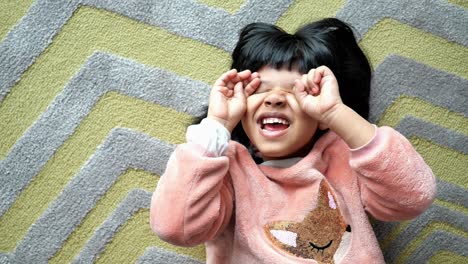 child playing on a carpet