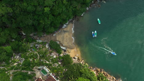 Aerial-birds-eye-shot-above-the-Colomitos-Beach,-in-sunny-Puerto-Vallarta,-Mexico