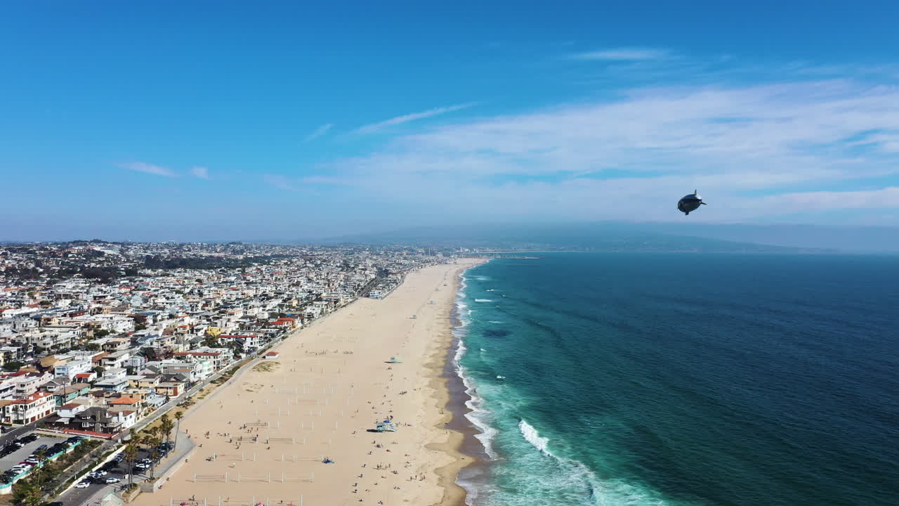 Distant View Of the Goodyear Blimp Over Manhattan Beach In California, USA. Aerial Shot