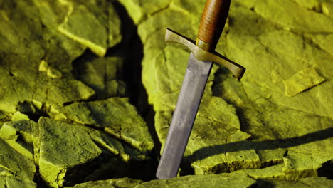 sword embedded in cracked earth under bright sunlight at dawn