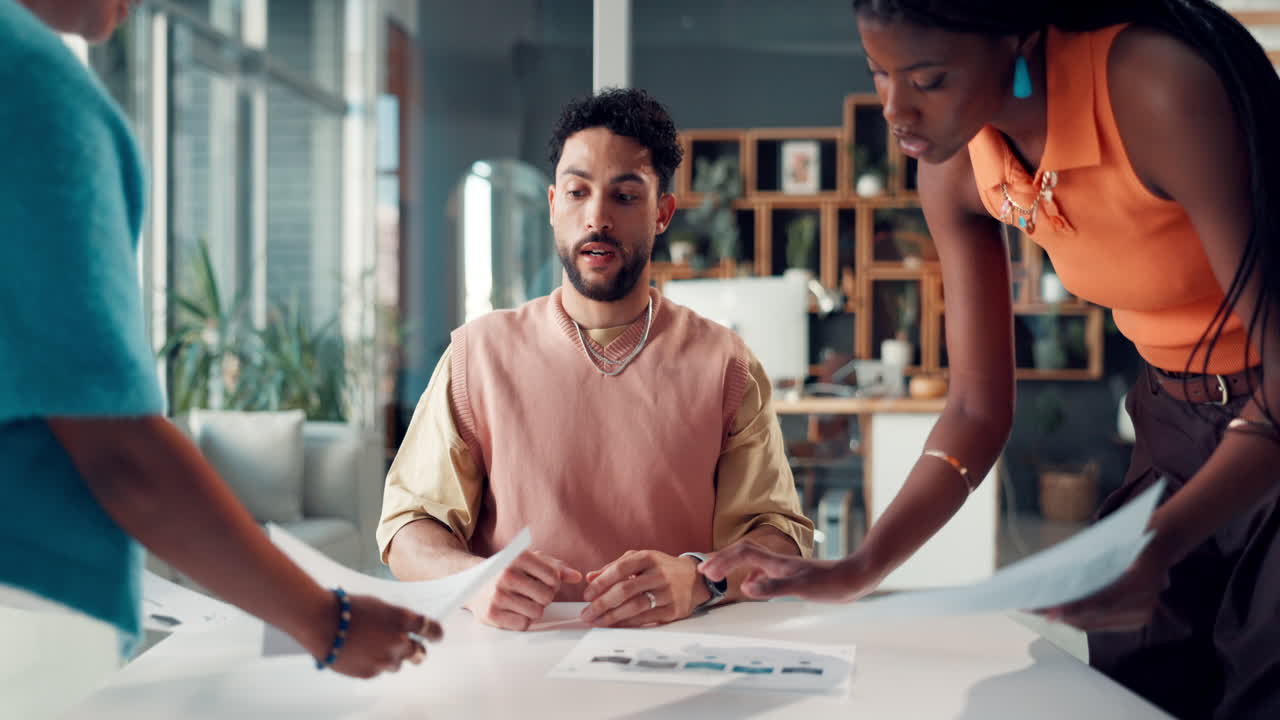 Business Team Collaborating on Documents in a Modern Office Meeting