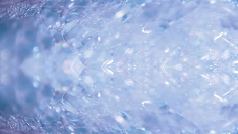 Artistic-blur-bubbles-and-dots-with-rotation-slow-motion-and-blue-color-copy-space-background