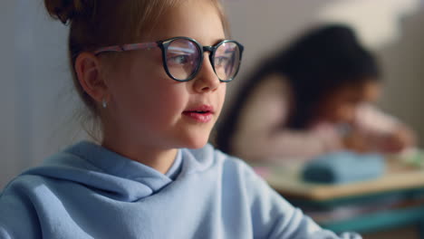 girl talking with teacher in classroom. student reciting poetry at lesson