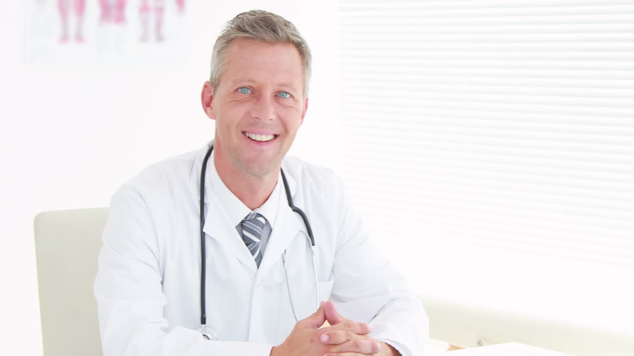 Smiling doctor looking at camera 