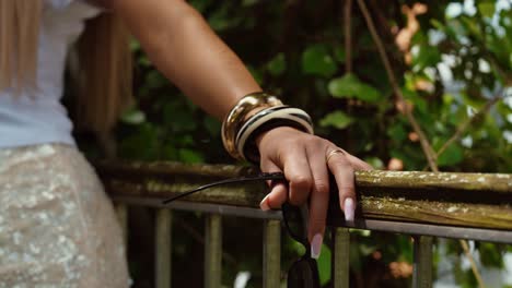 hand jewelry of a woman in a park