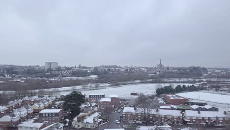 Tracking-drone-shot-of-snowy-Exeter-subburbs-looking-towards-the-town-centre