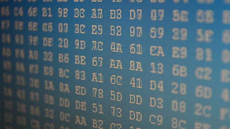 Shooting in the long term, code. Beautiful foreshortening of a code. Hexadecimal program code on screen. Animated background of moving binary code numbers