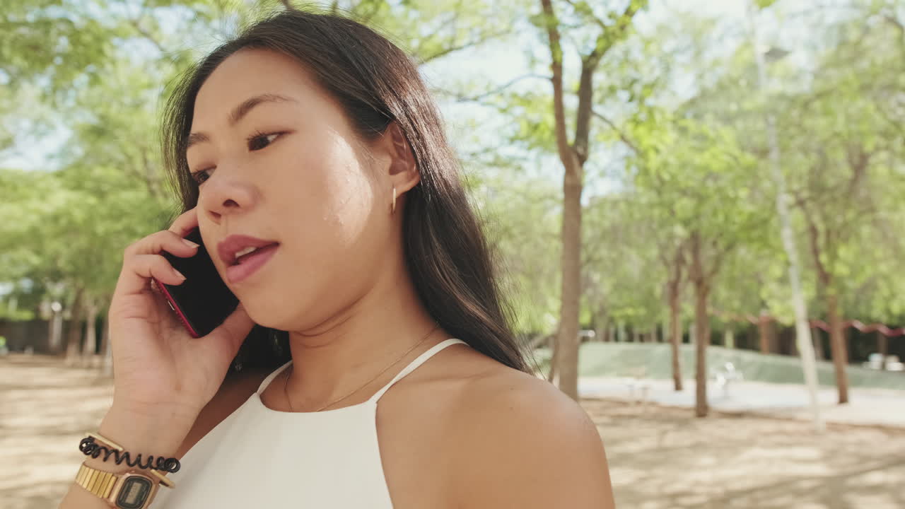 Woman talking on a cellphone outdoors