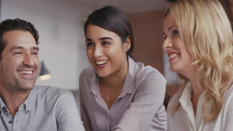 Group-of-business-people-using-computer-at-meeting