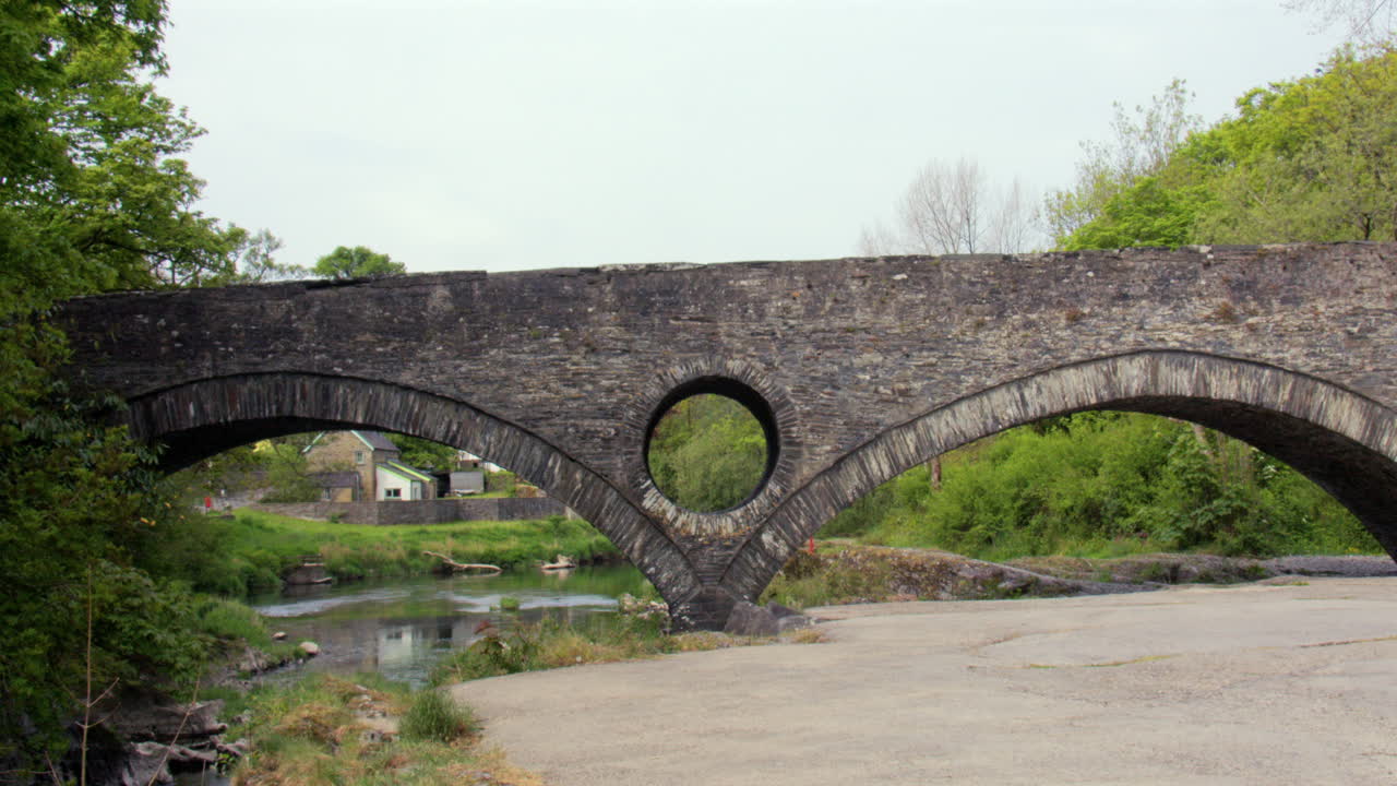 Wide shot of Cenarth bridge at Cenarth Falls on the river Teifi