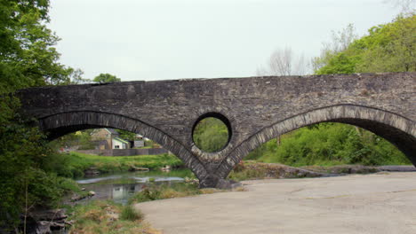wide shot of cenarth bridge at cenarth falls on the river teifi