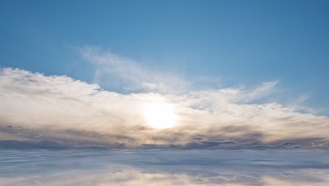 futuristic background consisting of time lapse clip of white fluffy clouds over blue sky and their reflection, video loop