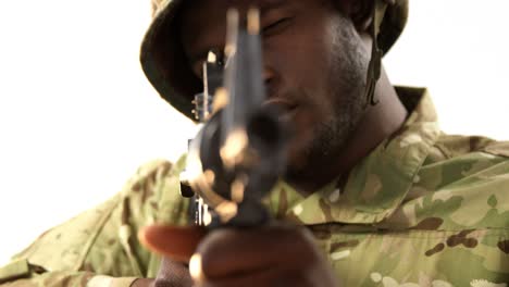 portrait of military soldier aiming with machine gun