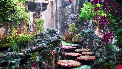 piedras húmedas en un hermoso jardín botánico que conducen a la cascada